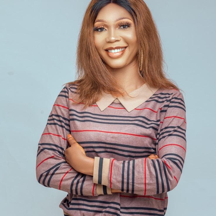 Kaveri Mehta, Lead Design Curator at Harbor Hearth Dawn, reviewing corporate floral arrangements